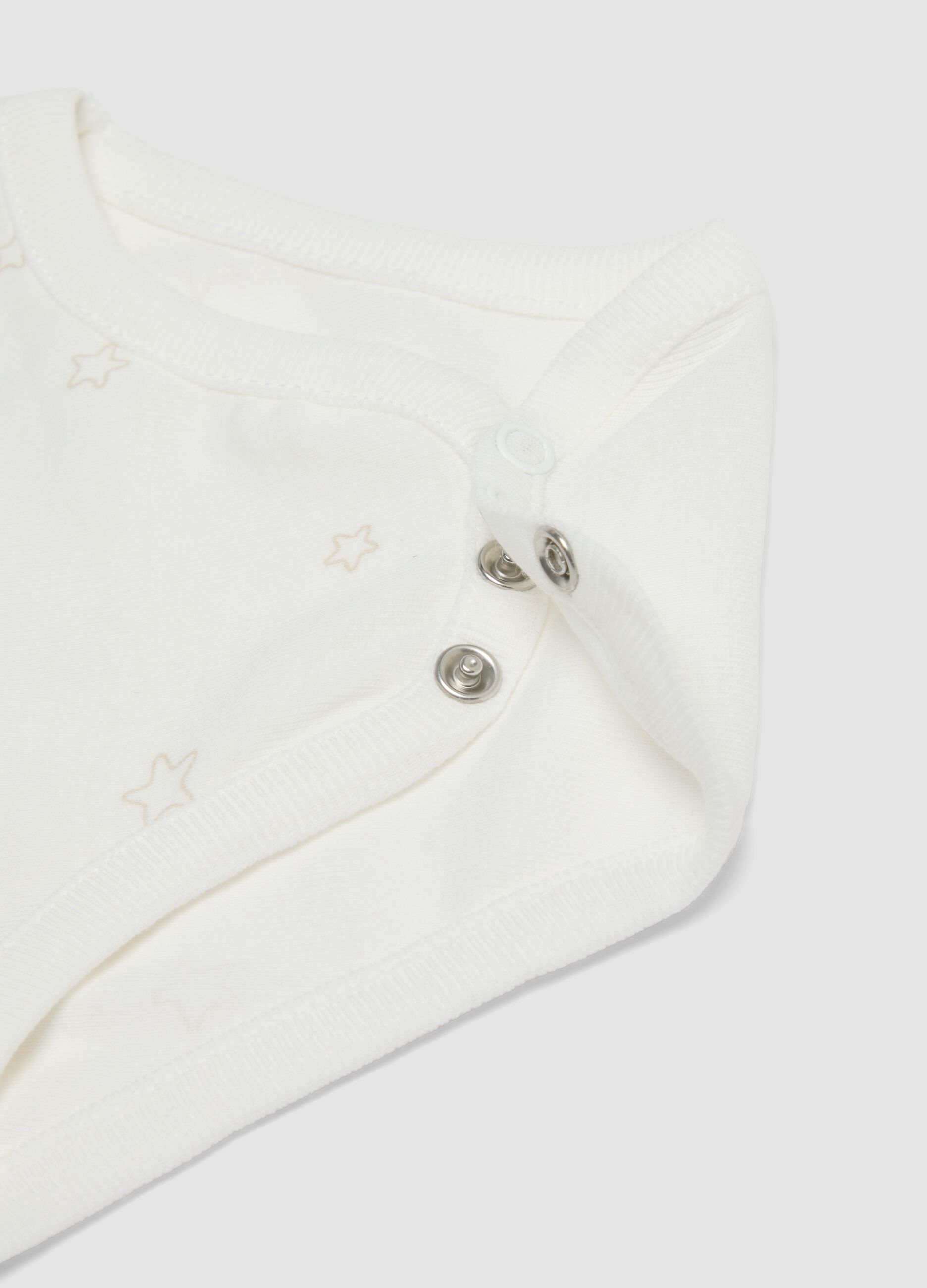 Two-pack of white organic cotton bodysuits with prints