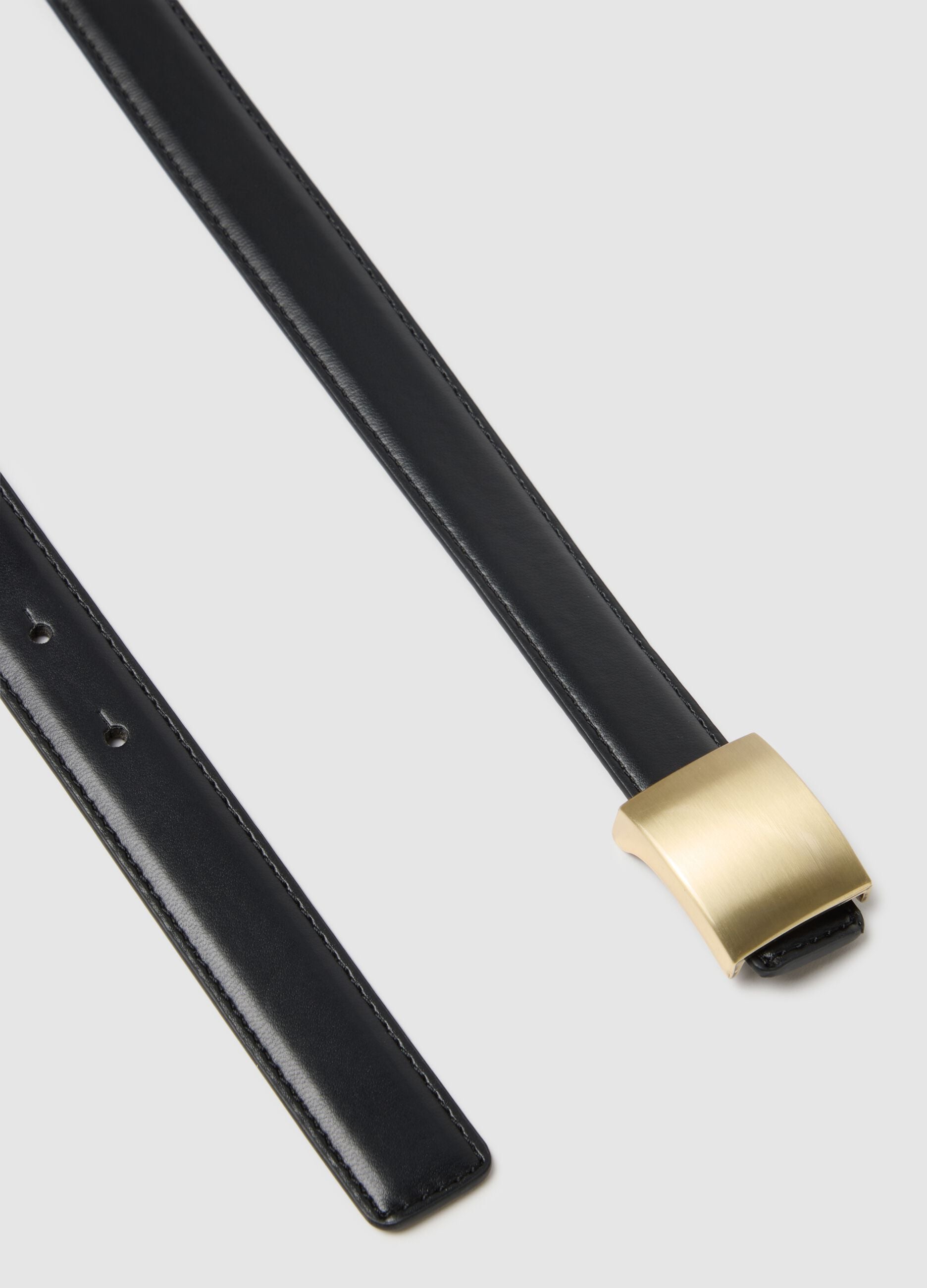 Black belt with golden buckle
