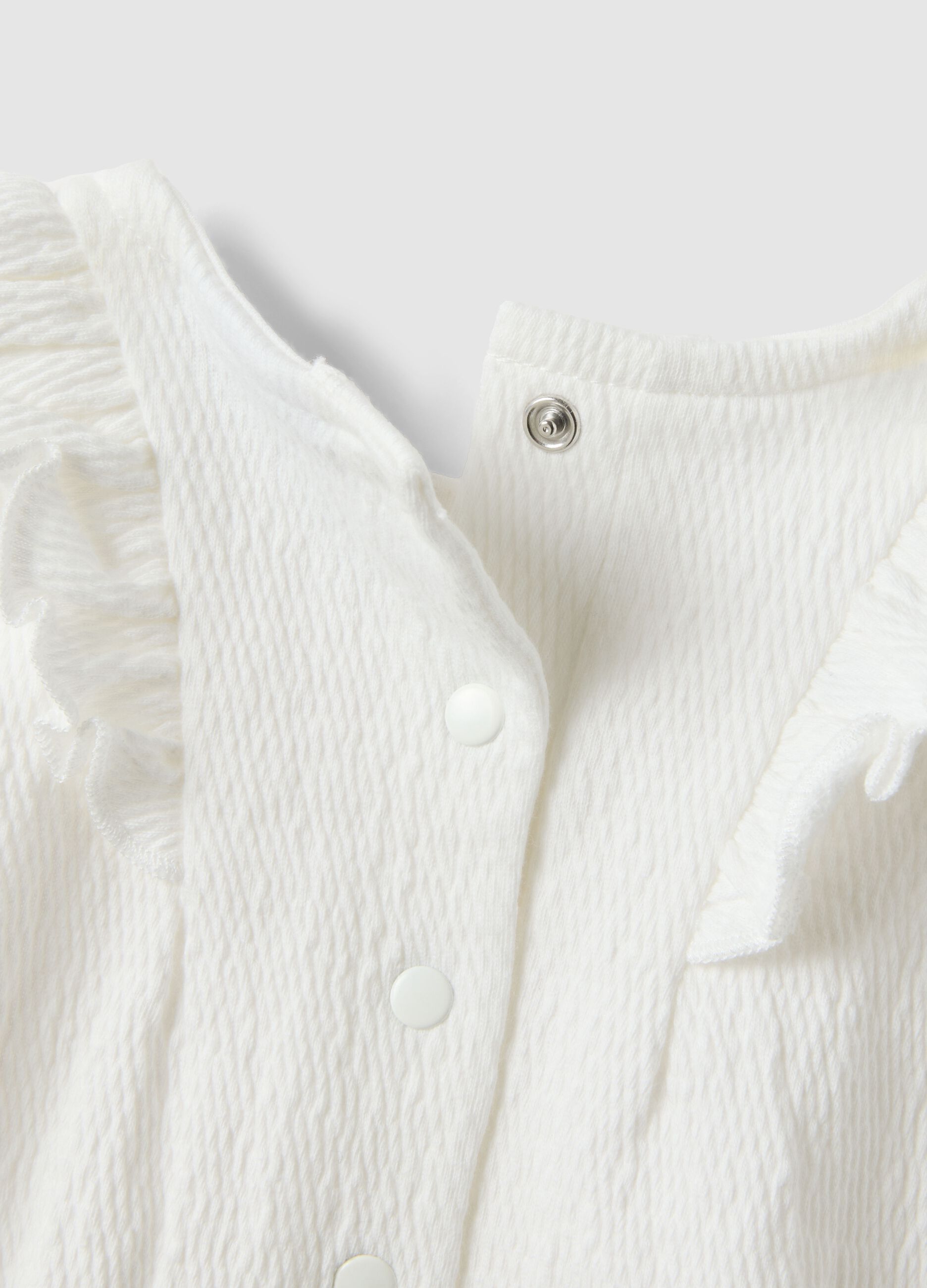 White baby body with ruffles in organic cotton blend