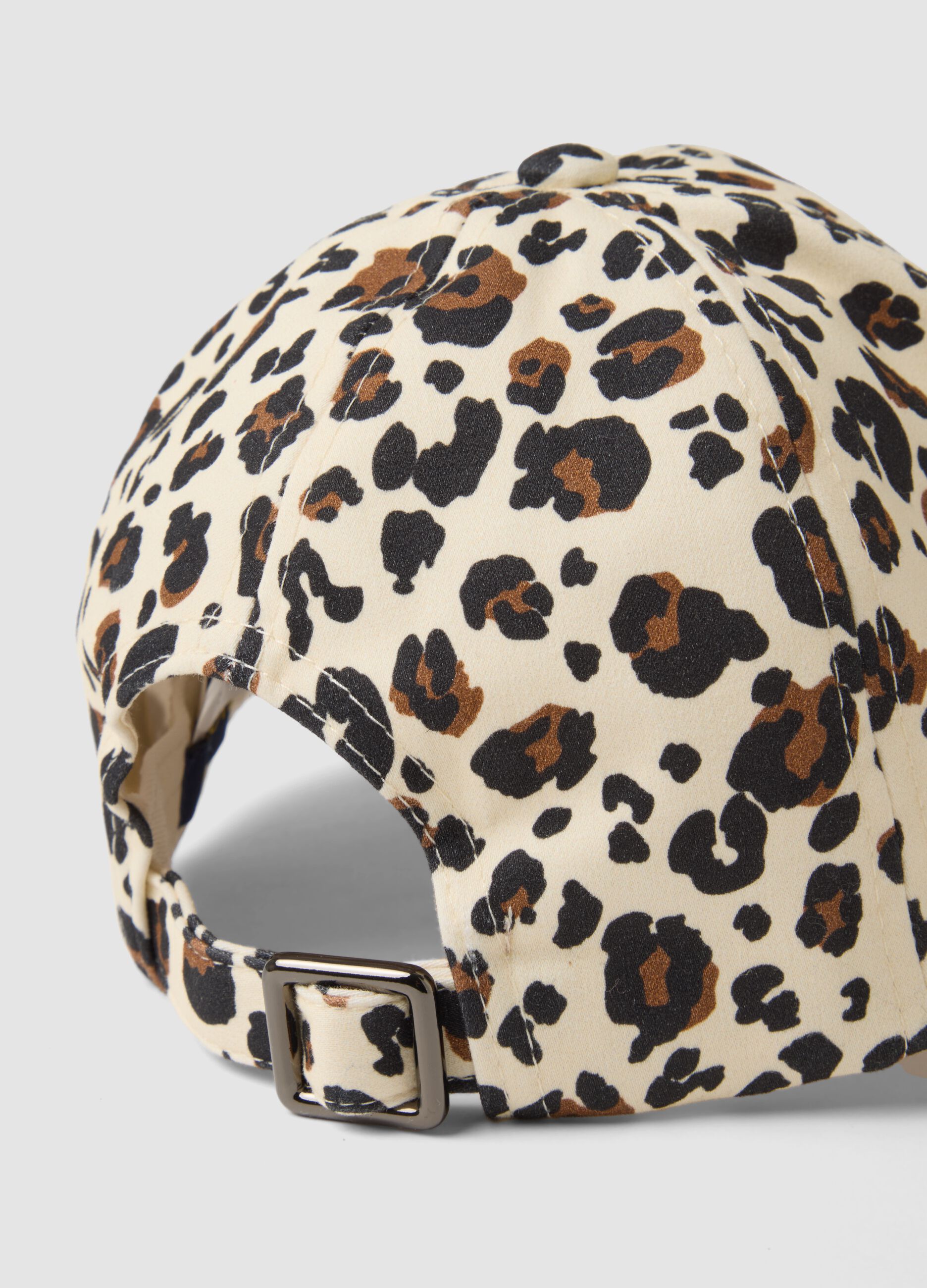 Beige stretch cotton cap with animal print