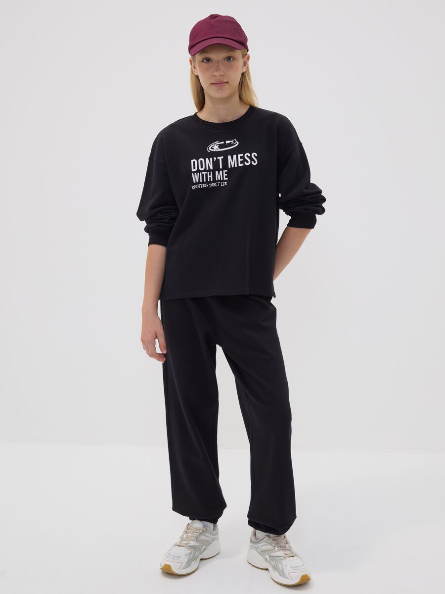 Black organic cotton-blend jogger trousers with printed detail for girls_0