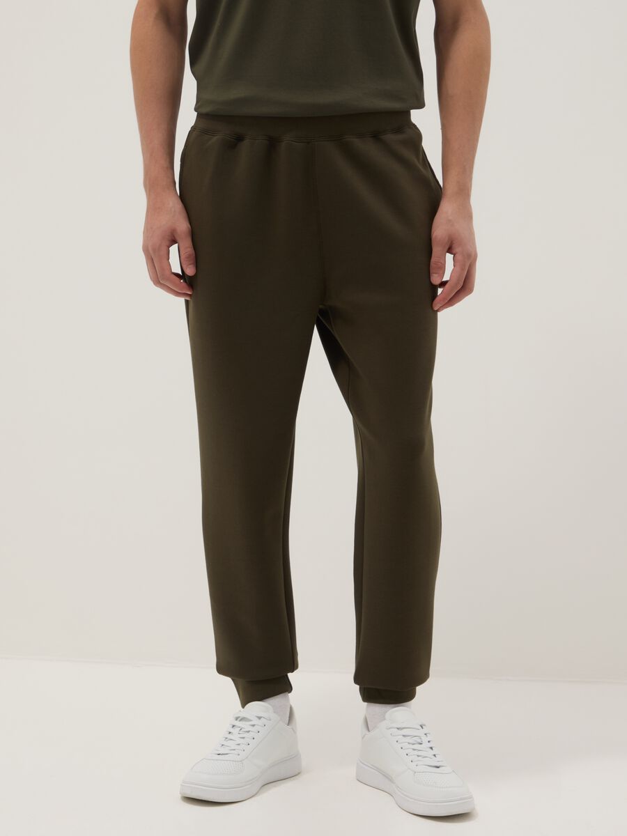 Brown cotton blend regular fit jogger trousers_1
