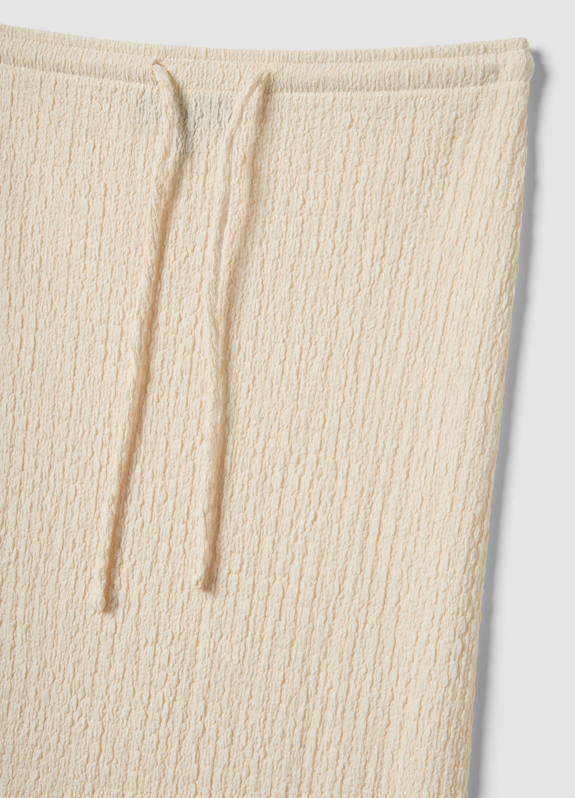 Beige long skirt in stretchy textured fabric