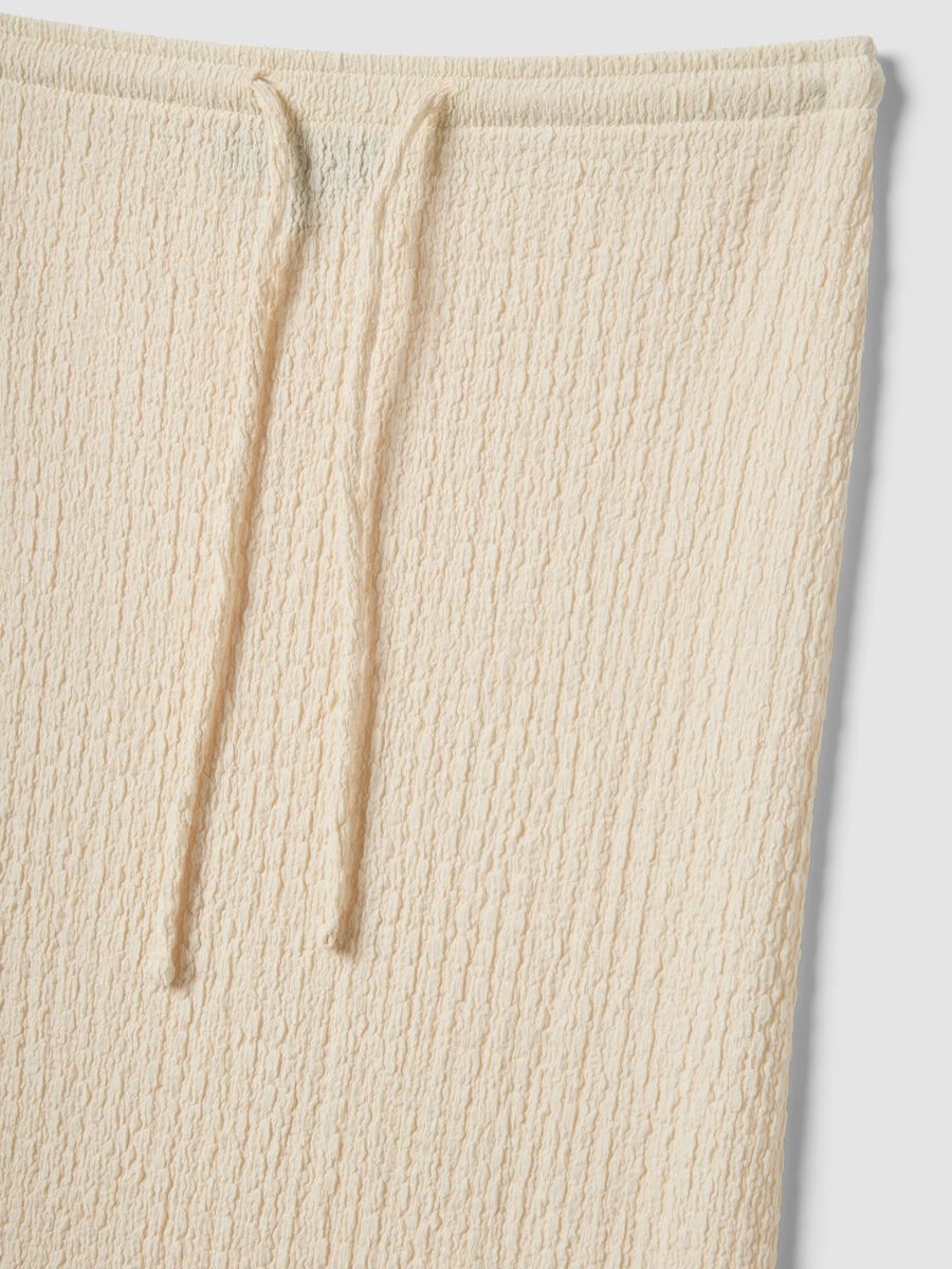 Beige long skirt in stretchy textured fabric_5