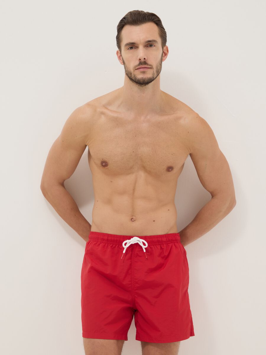 Red swim shorts with elasticated waist_0